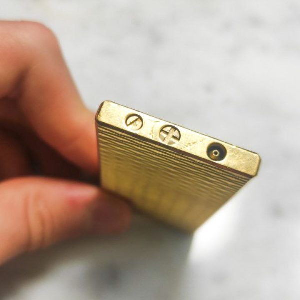 Mechero Zippo Givenchy vintage bañado en oro