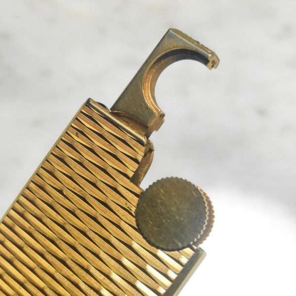 Mechero Zippo Givenchy vintage bañado en oro