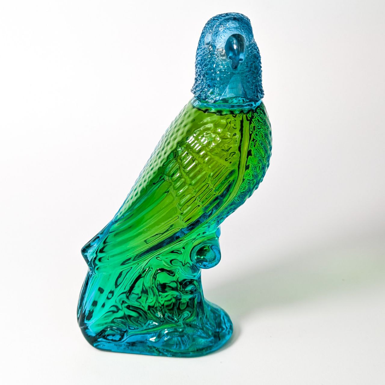 Botella vintage de colonia Avon Island Parakeet Moonwind c.1970