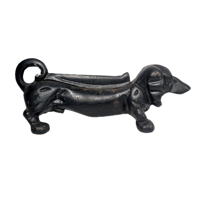 Perro daschund quitabarro de hierro fundido