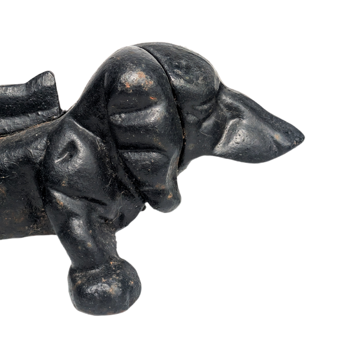 Perro daschund quitabarro de hierro fundido